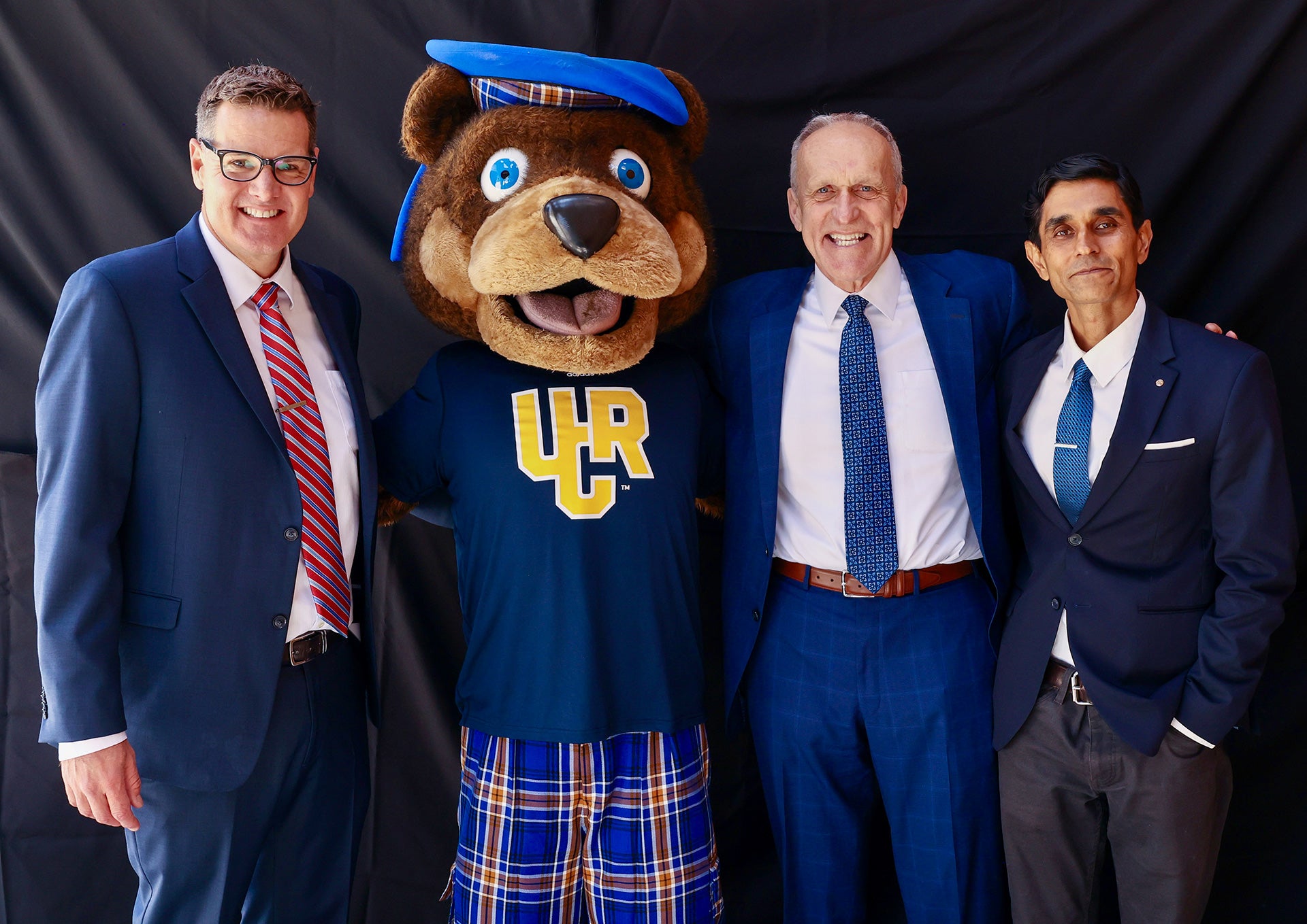 Agam Patel with Chancellor Kim Wilcox, Scotty the Bear, and Jeff Girod