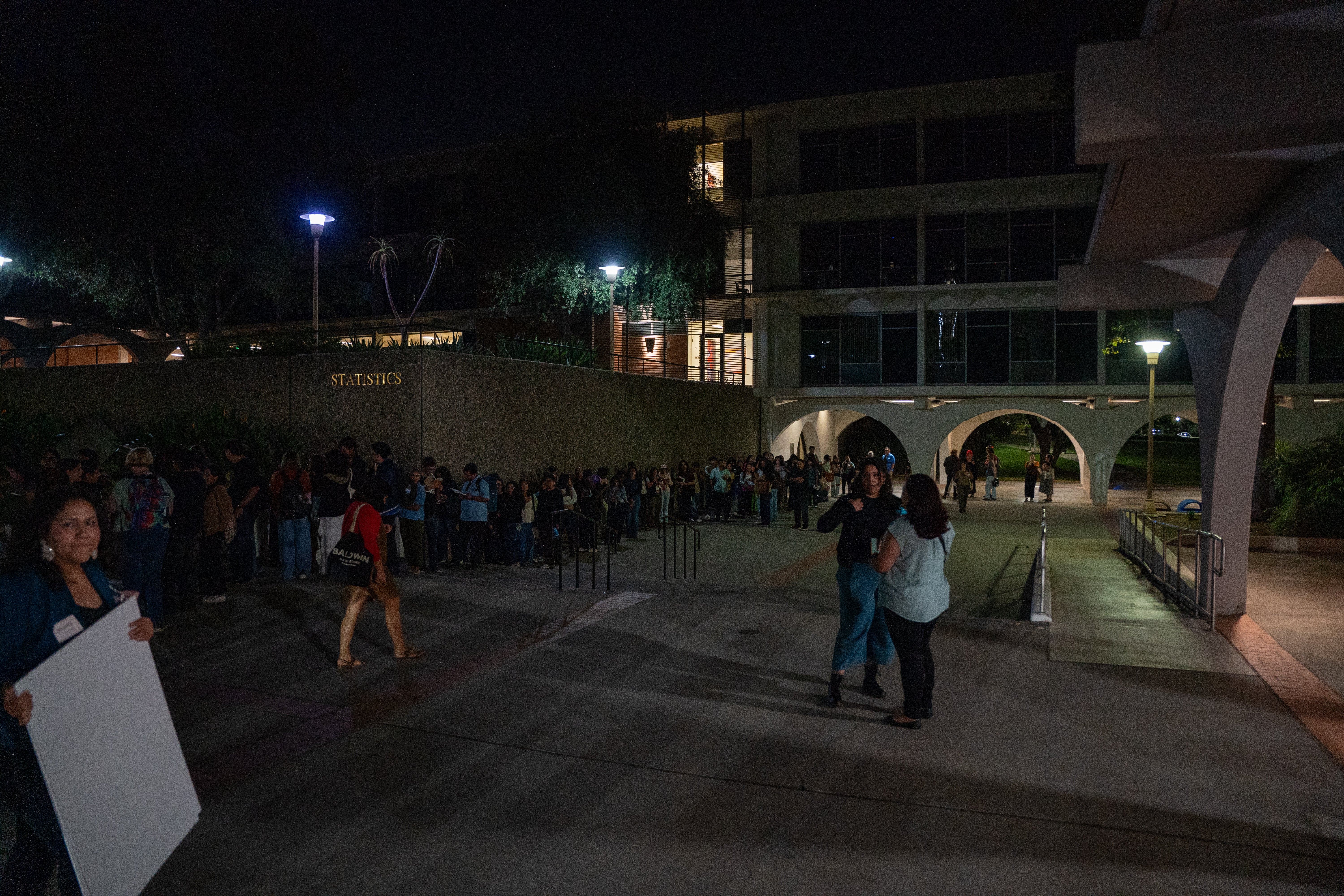 Audience members line up for autographs