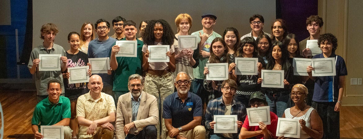 The student filmmakers holding their certificates with the program volunteers and staff. Credit: UCR / Lyndsey Rankin