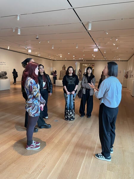 Dr. Seunghee Oh speaks with students